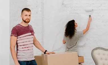 man-posing-near-woman-painting-wall 1 (2)