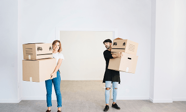 moving-concept-with-couple-holding-boxes 1